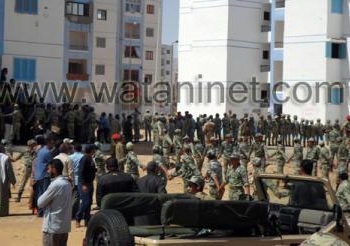 بالصور ..: عناصر الجيش الثالث بالسويس يخلى 3 عمارات بالسويس