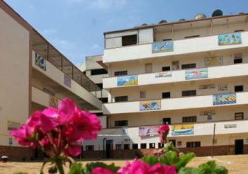 إزالة الشعارات الدينية من على أسوار مدارس السويس