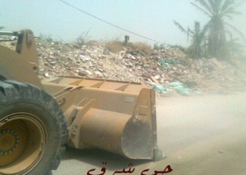 بالصور إزالة التعديات علي أراضي الدولة بطريق 14 مايو 