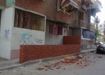 حى الزهور يزيل مخالفة بناء بمعدات الحى ببورسعيد 