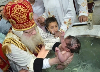 الأنبا أثناسيوس يسيم كهنة جدد ويعمد طفل