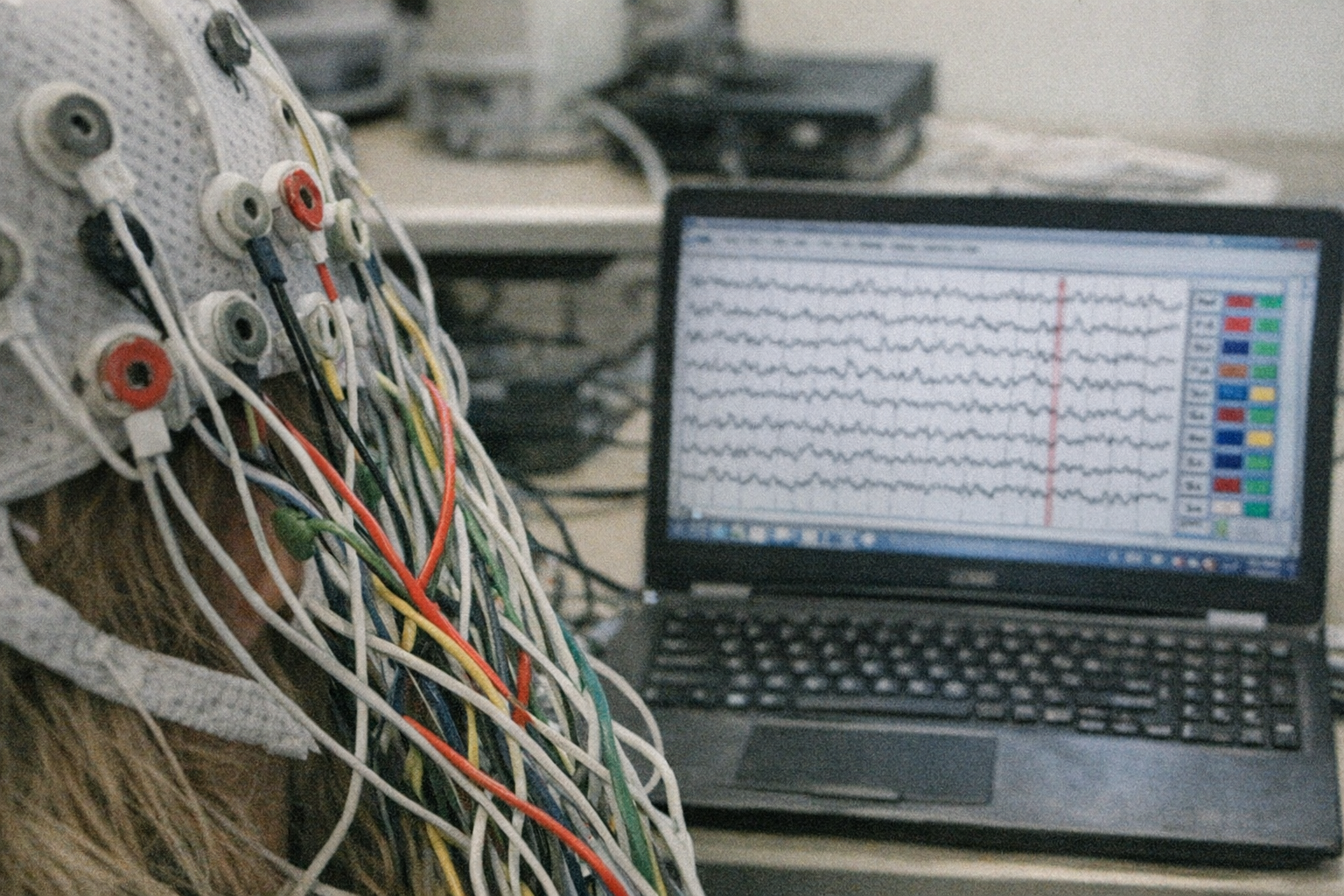Close-up of a brain sensor headset and laptop