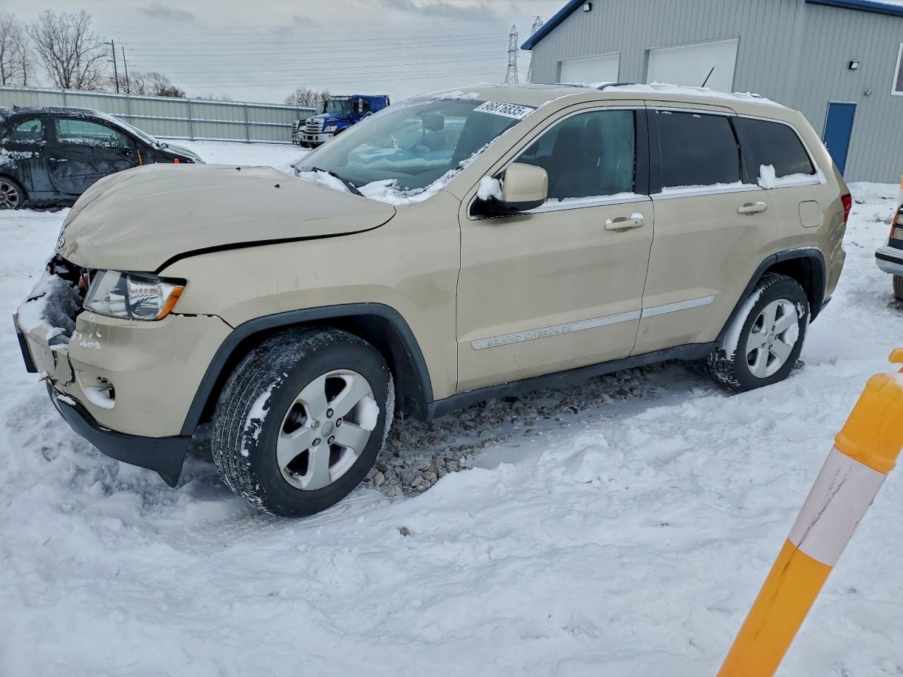 2011 JEEP GRAND CHEROKEE LAREDO — FRONT END damage — photo 1