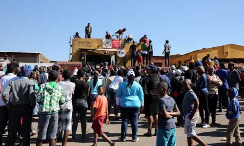 South African reporters attacked covering protests, broadcaster suspends journalists