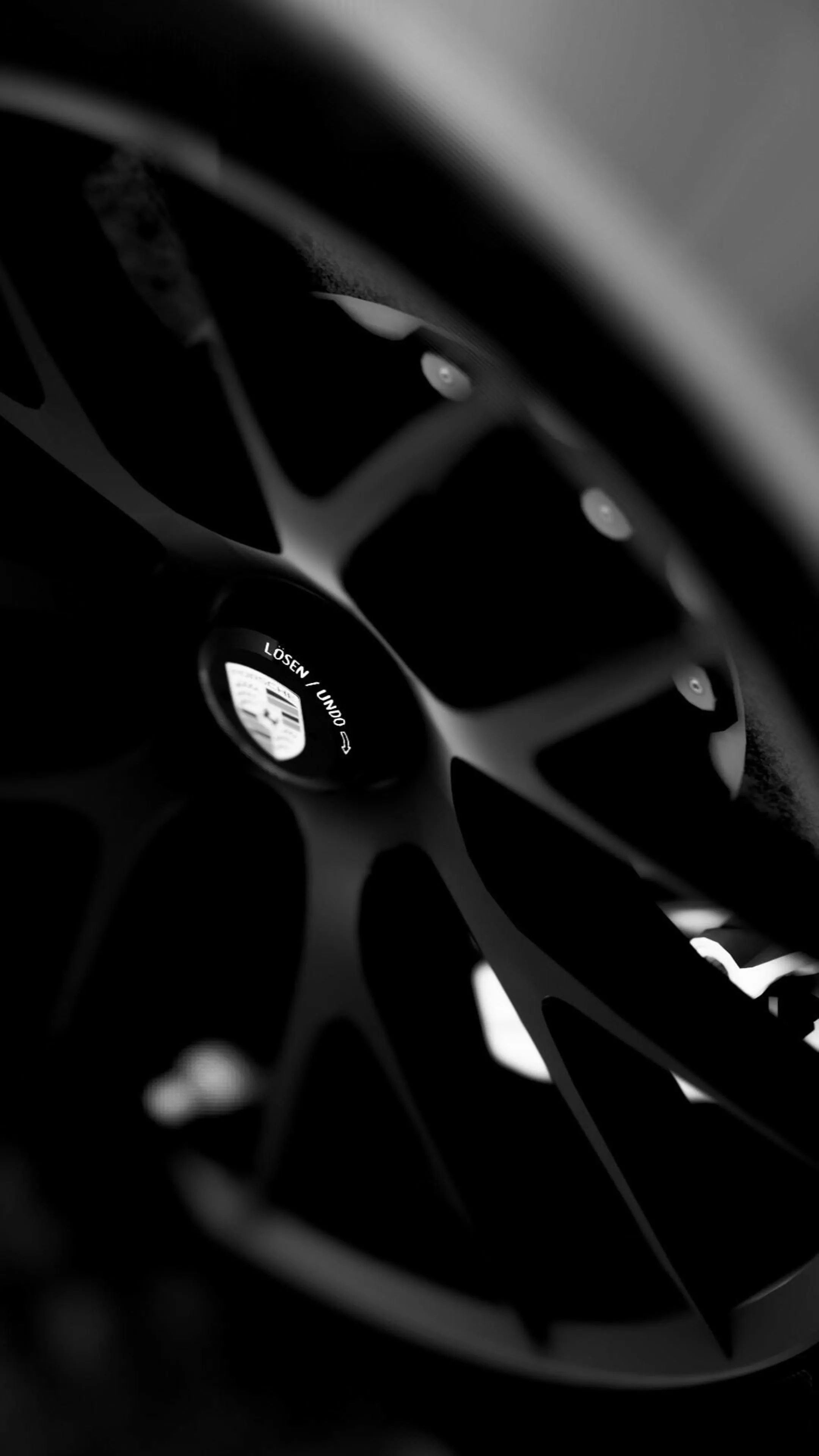 Close Up of Luxury Sports Car Black Alloy Wheel Design