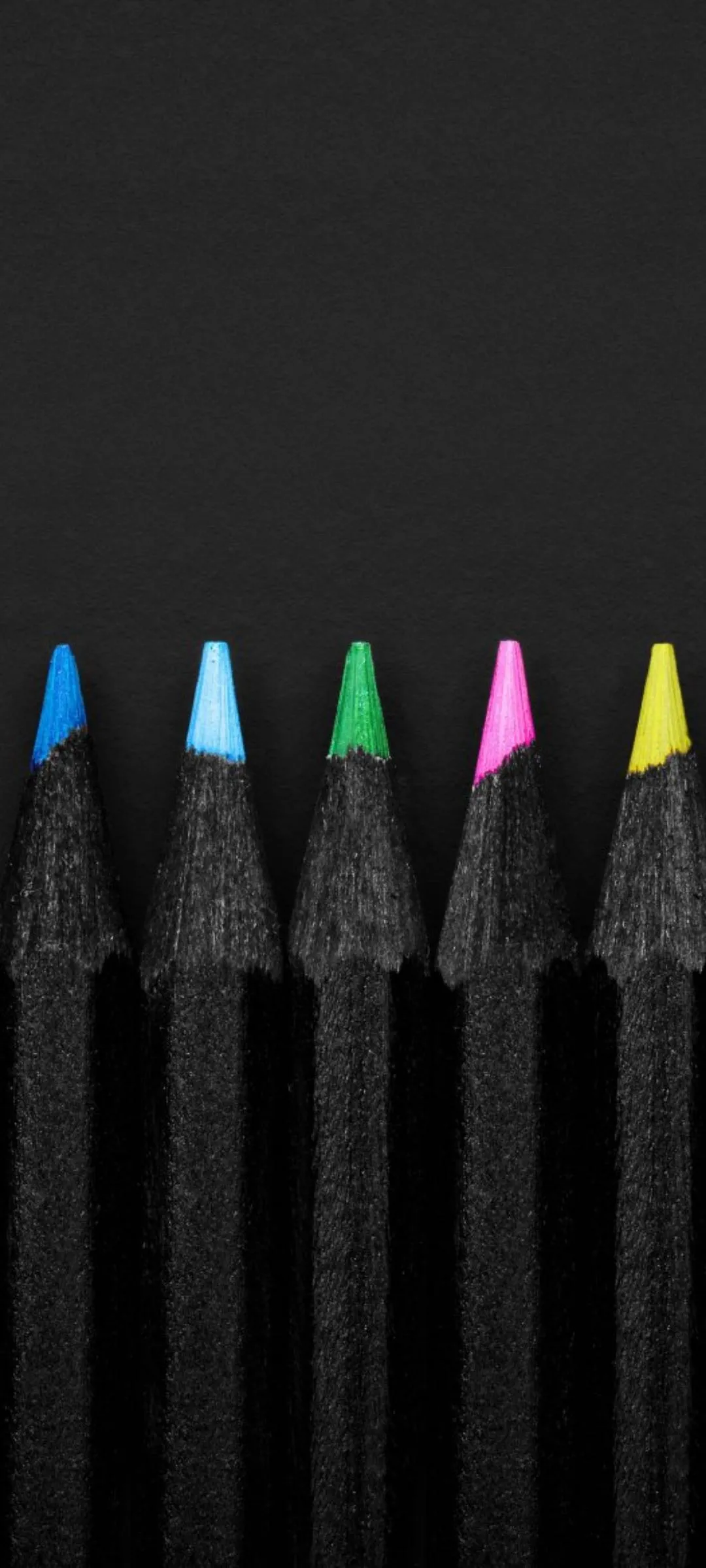 Colored Pencils Aligned in Minimal Dark Composition