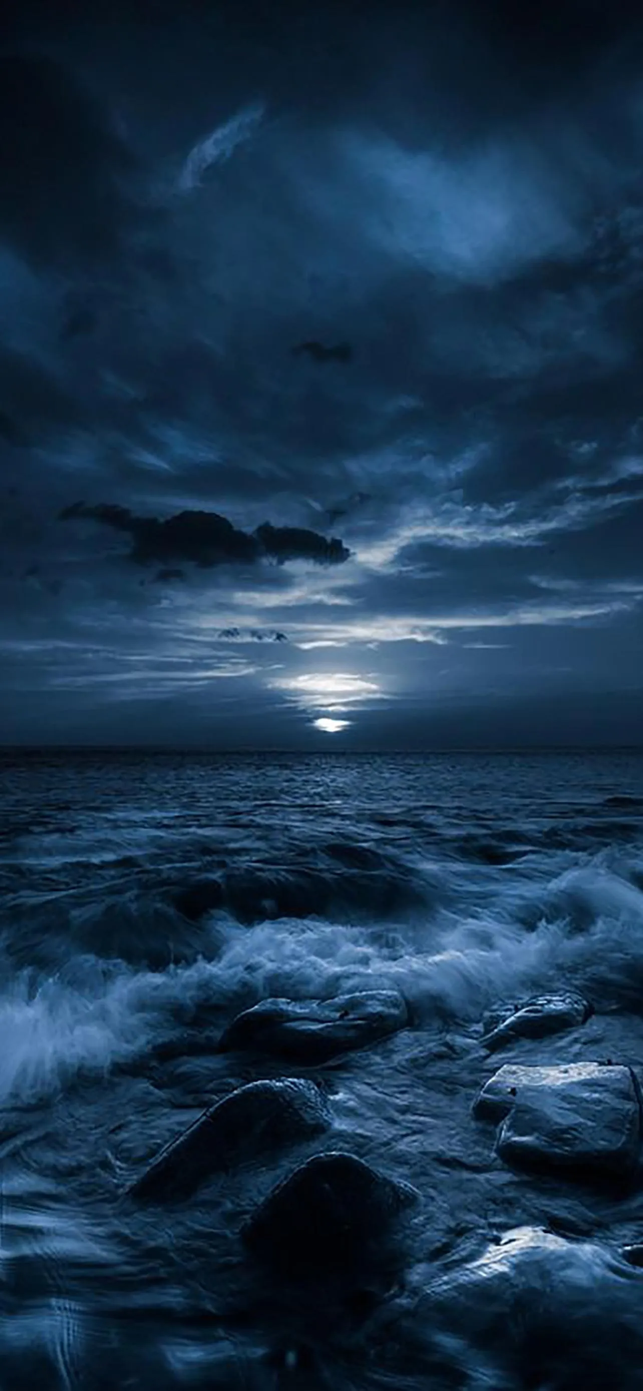 Dark Night Sky Over Ocean with Deep Blue Serenity Image