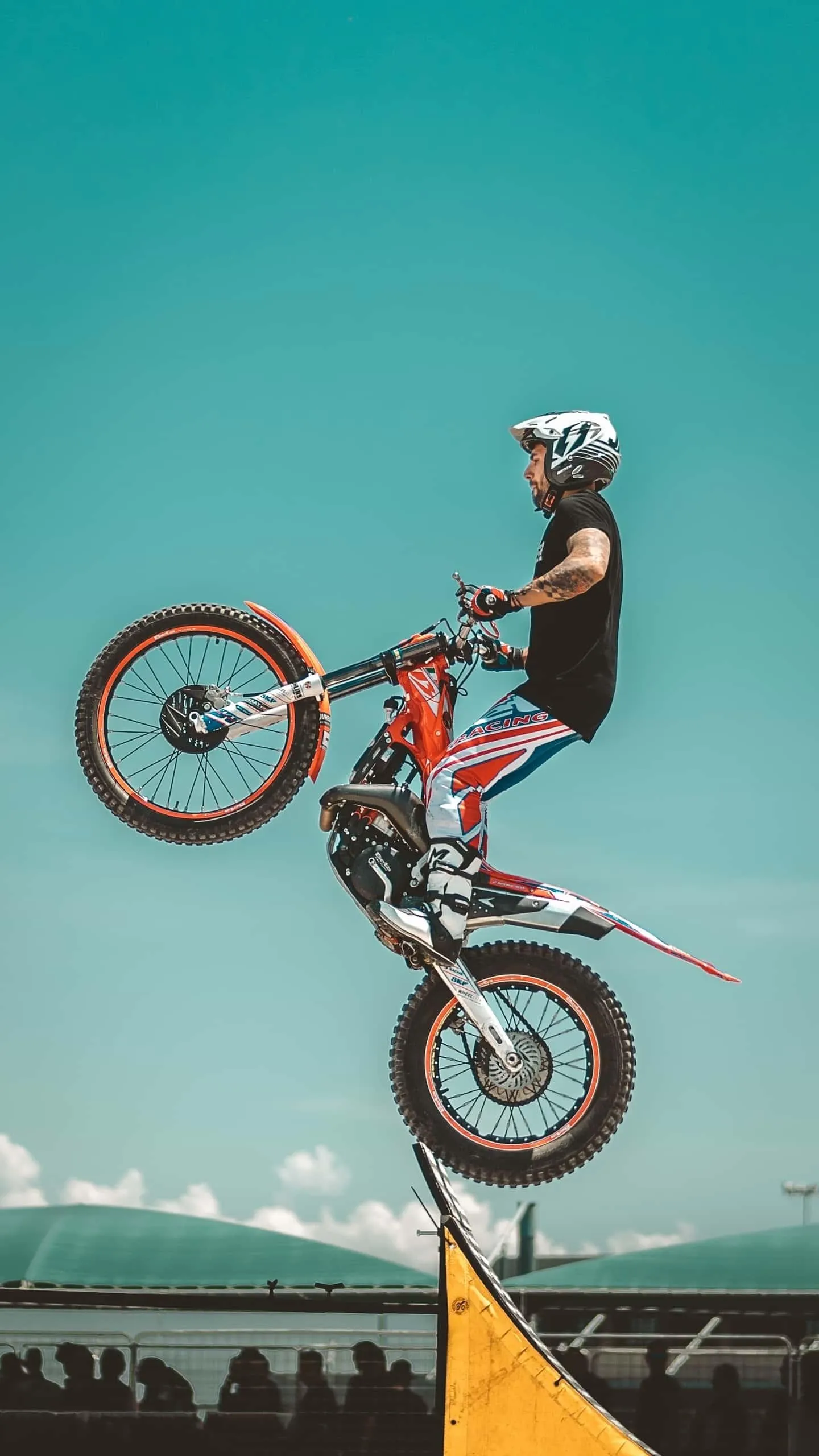 Extreme BMX Rider Performing High Air Trick Wallpaper