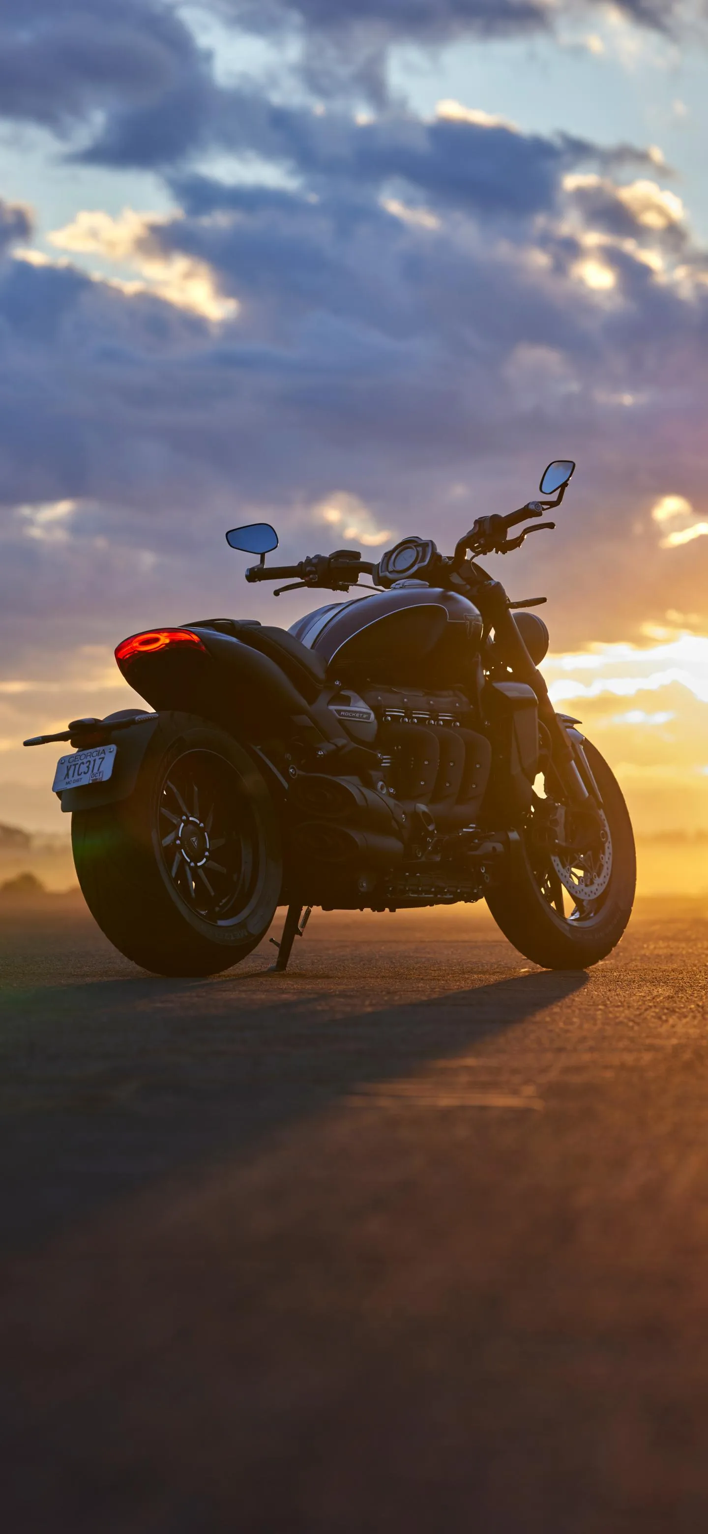 Motorcycle Rider in Golden Sunset Highway Adventure