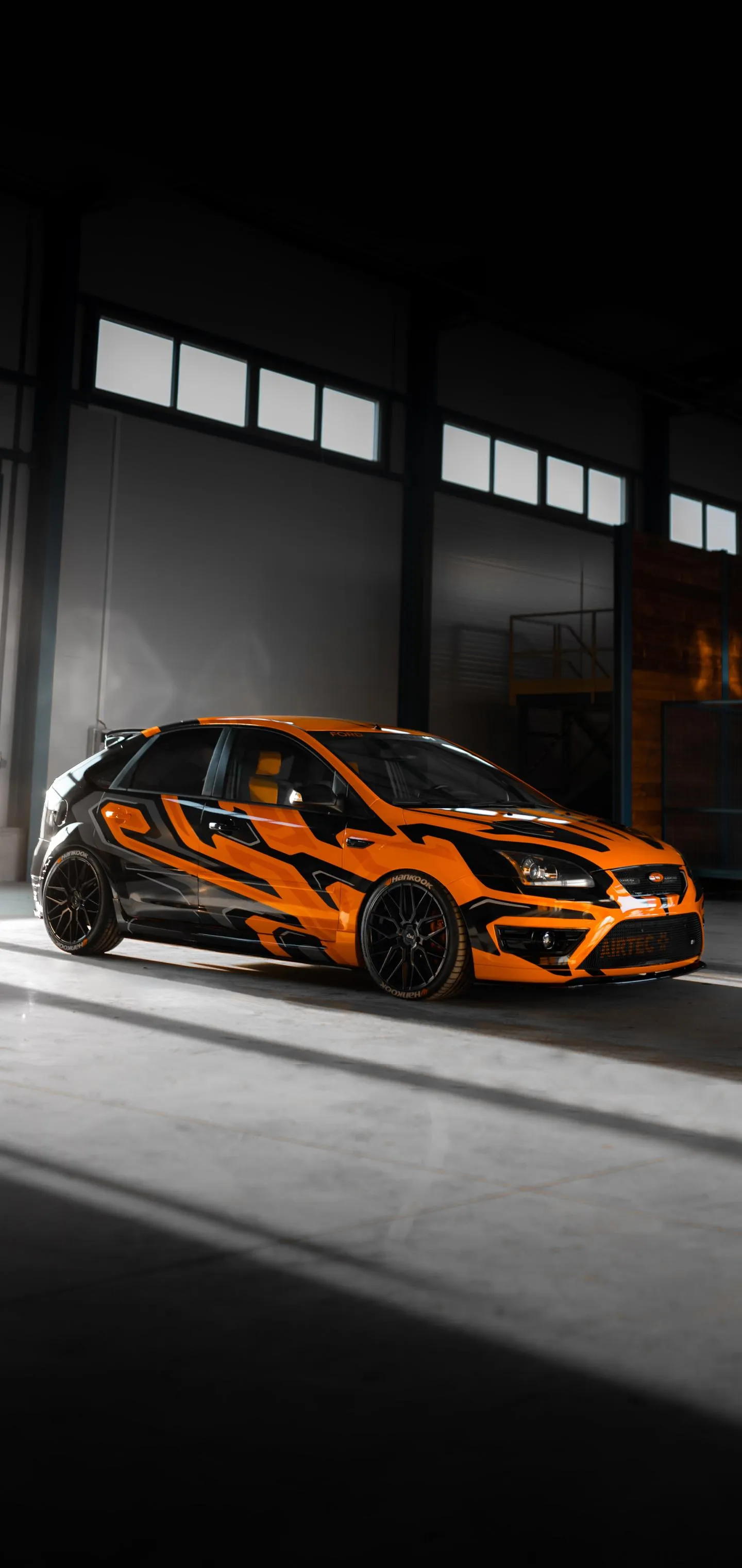 Orange Supercar in Dark Garage Aesthetic free Photo
