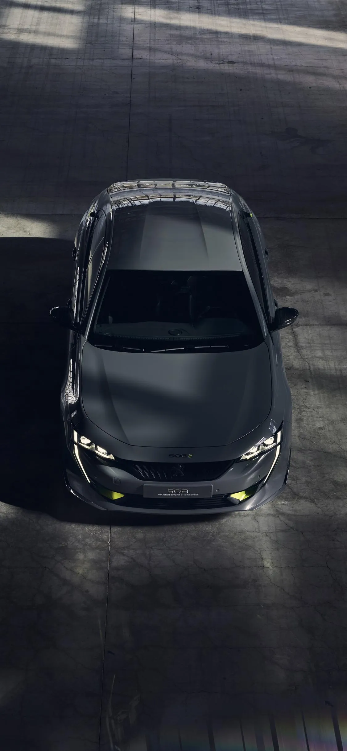 Top View Luxury Black Car in Dark Garage Wallpaper