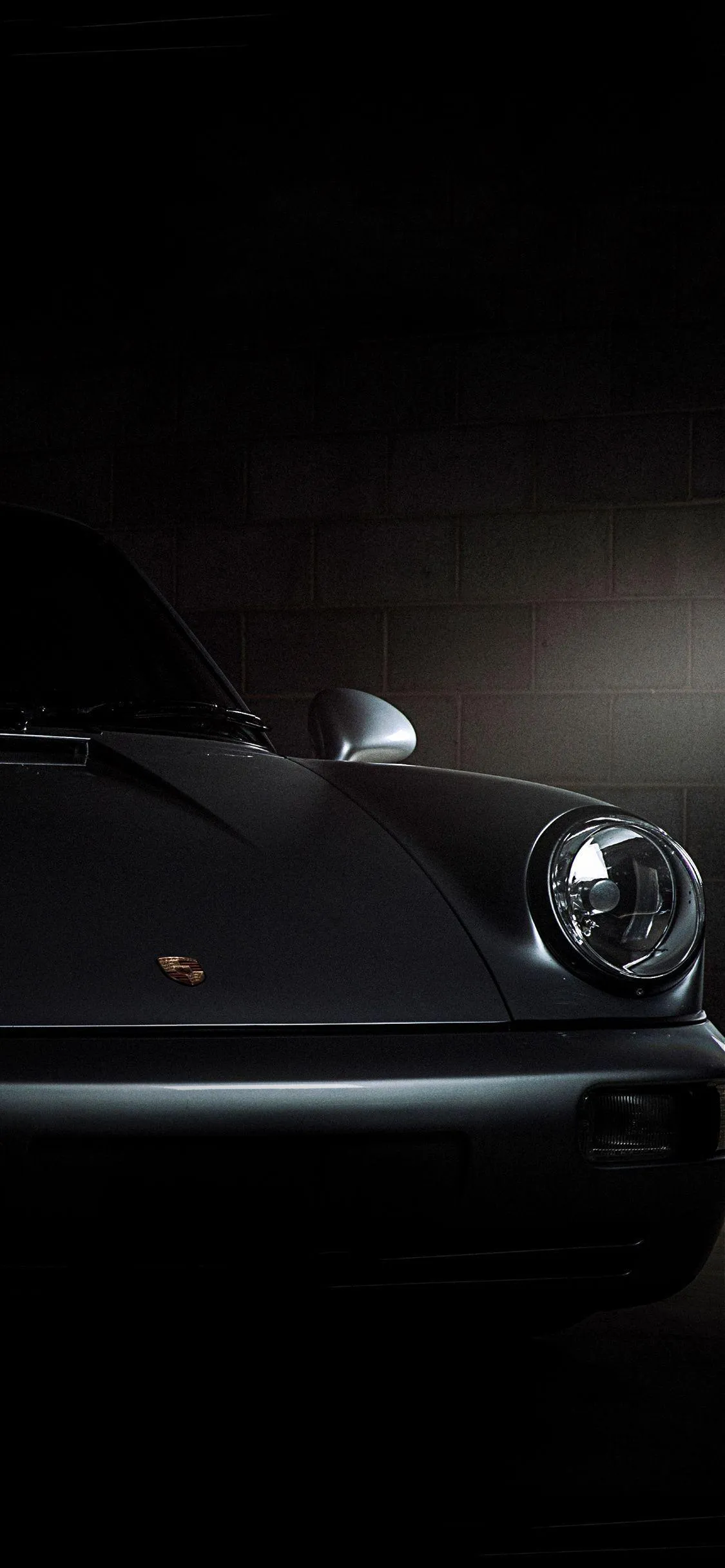 Vintage Black Car with Subtle Light Reflection Wallpaper