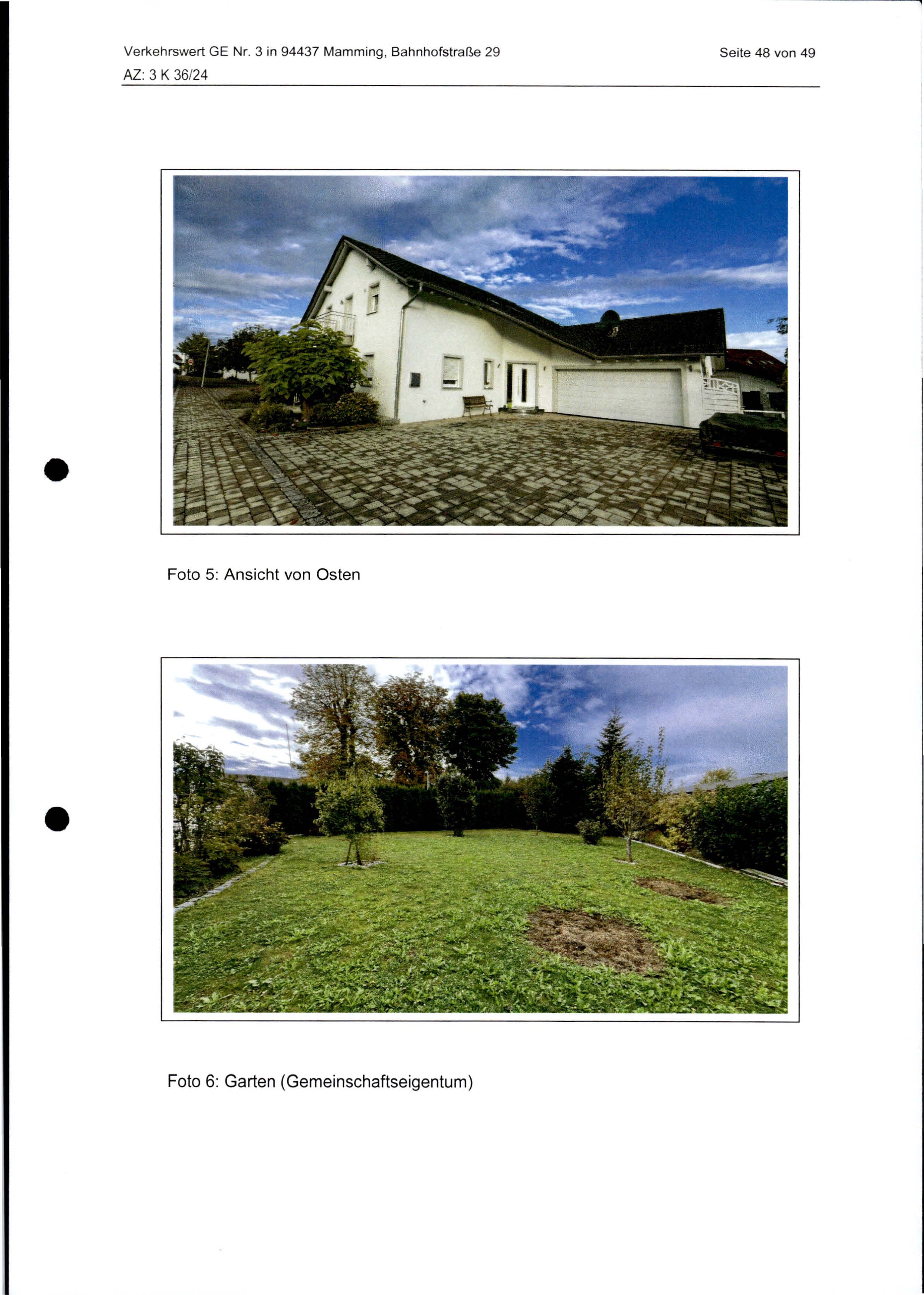 Weißes Zweifamilienhaus mit Hof und Vorgarten