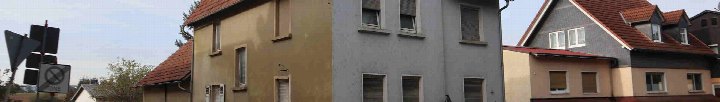 Seitenansicht mehrerer Wohnhäuser mit Dächern und Fenstern in Langgöns, Am Mühlberg 6
