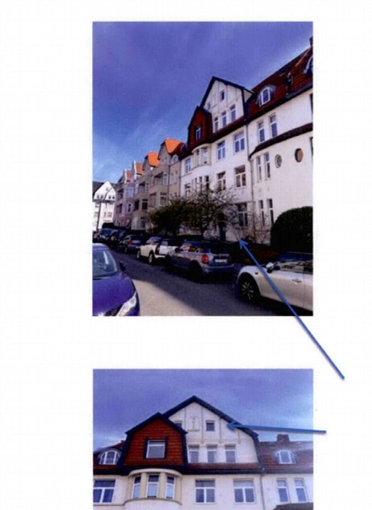 Außenansicht der Wohnhäuser am Volgersweg 1 in Hannover mit geparkten Autos und Dachgauben unter blauem Himmel