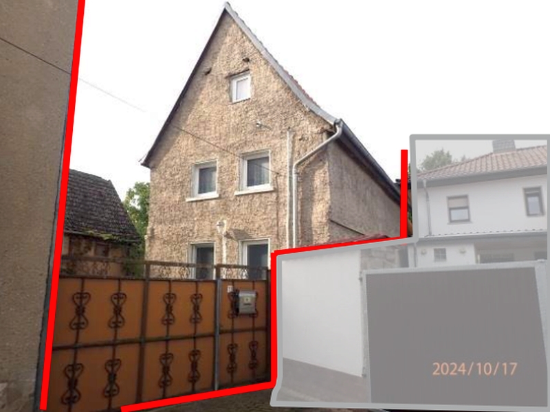 Gebäude in Kaiserpfalz, Kirchplatz 11, mit Steinmauerwerk, Dachgauben und Metallzaun im Vordergrund. Datum: 2024/10/17