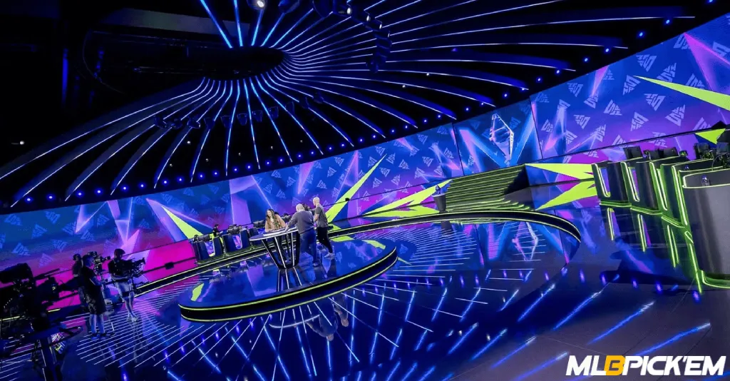BLAST Slam event broadcast stage with hosts and analysts under dynamic lighting and LED backdrop
