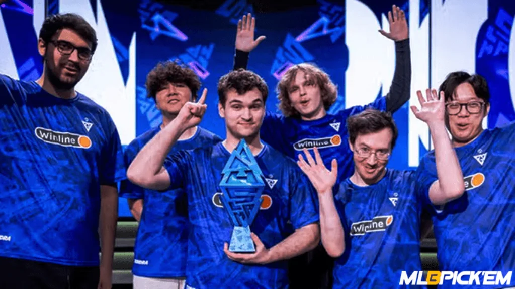 Tundra Esports celebrate winning BLAST Slam II with trophy on stage