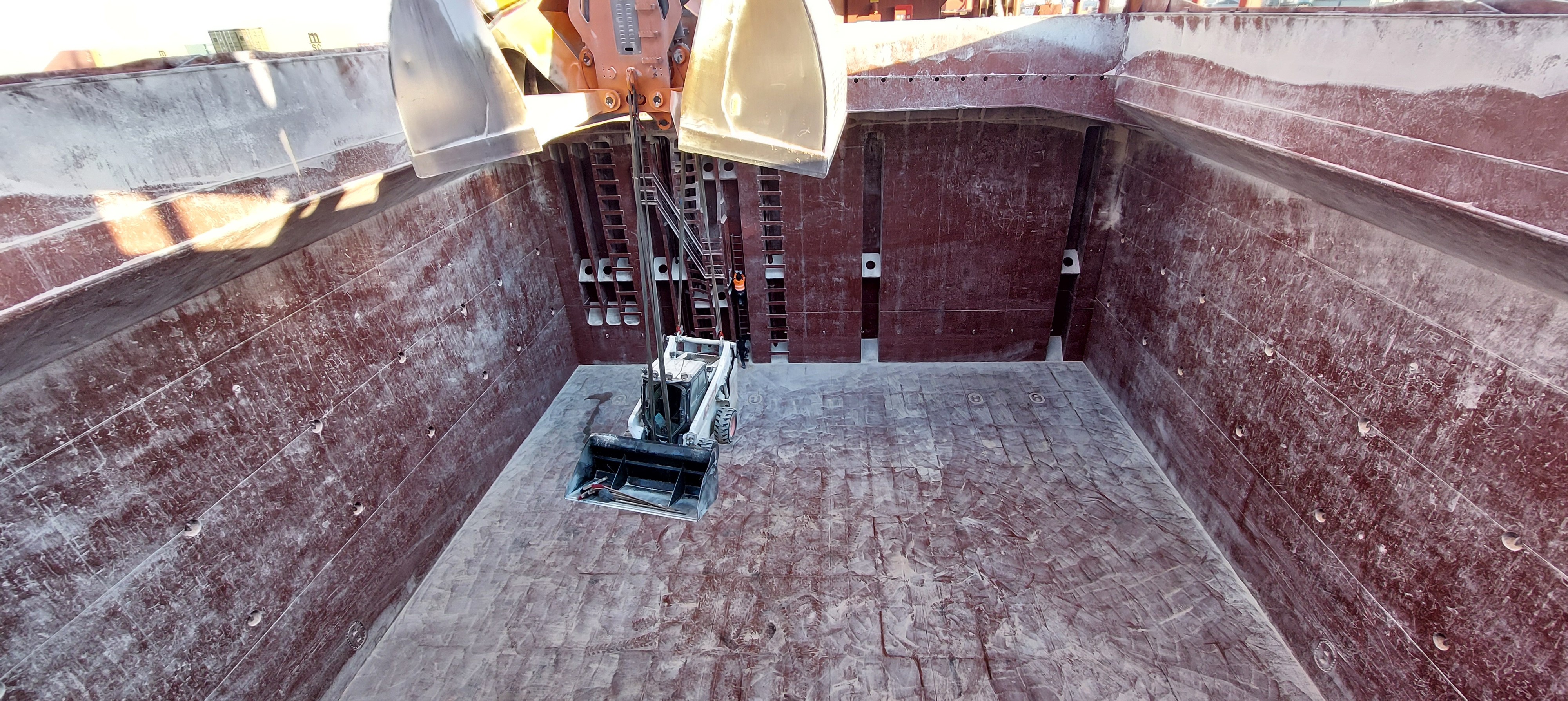 FOSFA discharge supervision. View of cargo hold close to completion of discharge of sunflower meal in pellets