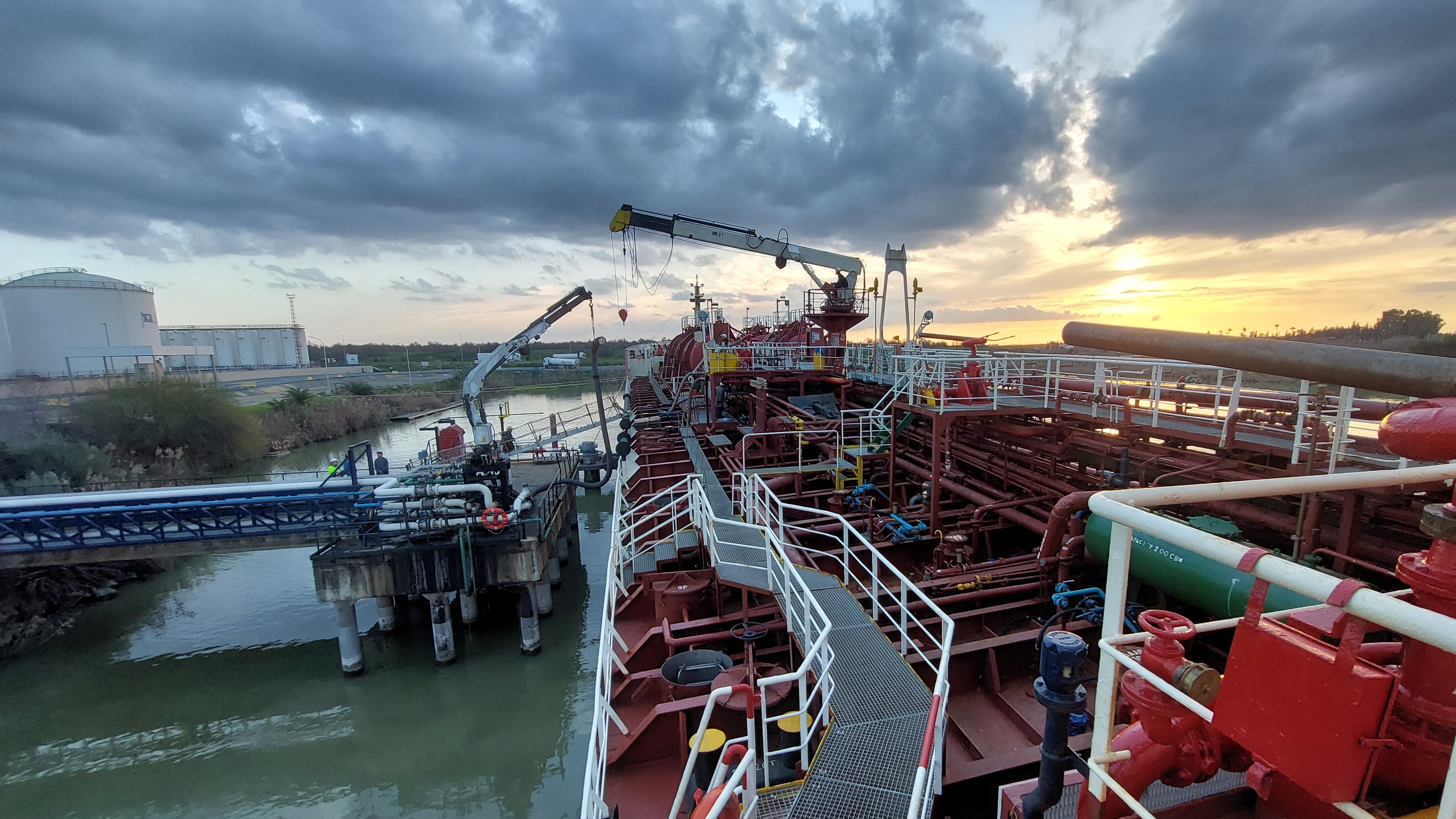Tanker alongside berth under discharge of sunflower seed oil