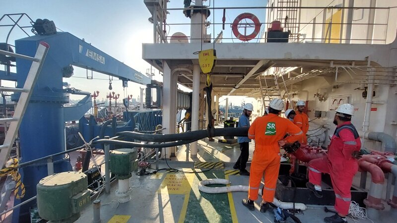 Bunker station. Bunkering in progress, hoses connected
