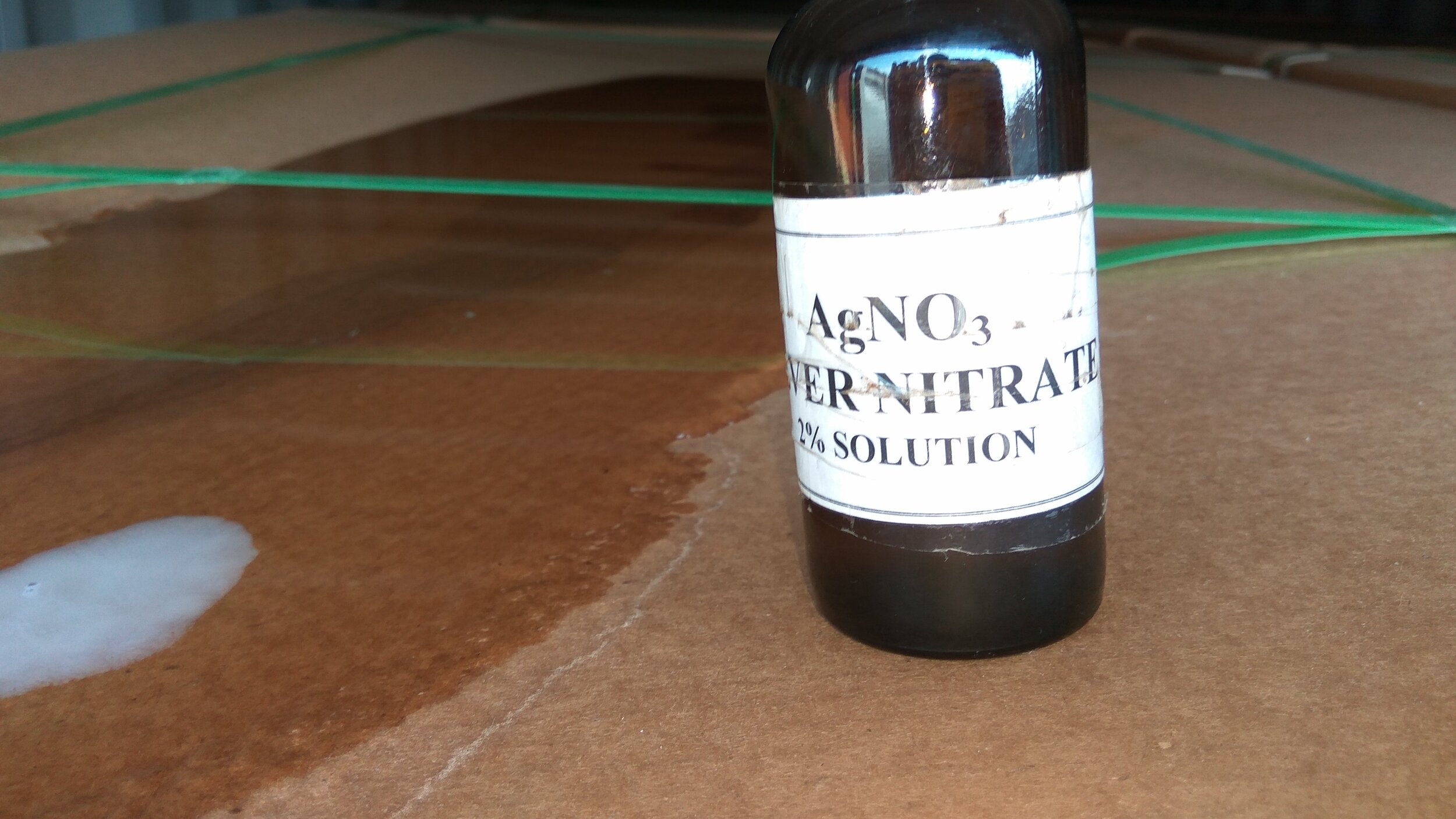 Damage to container. Hole at the top of container. Testing of wetted cargo for possible contact with seawater using a Silver Nitrate solution - positive result