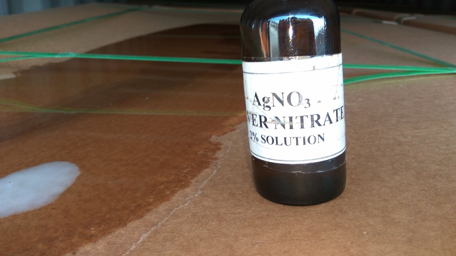 Damage to container. Hole at the top of container. Testing of wetted cargo for possible contact with seawater using a Silver Nitrate solution - positive result