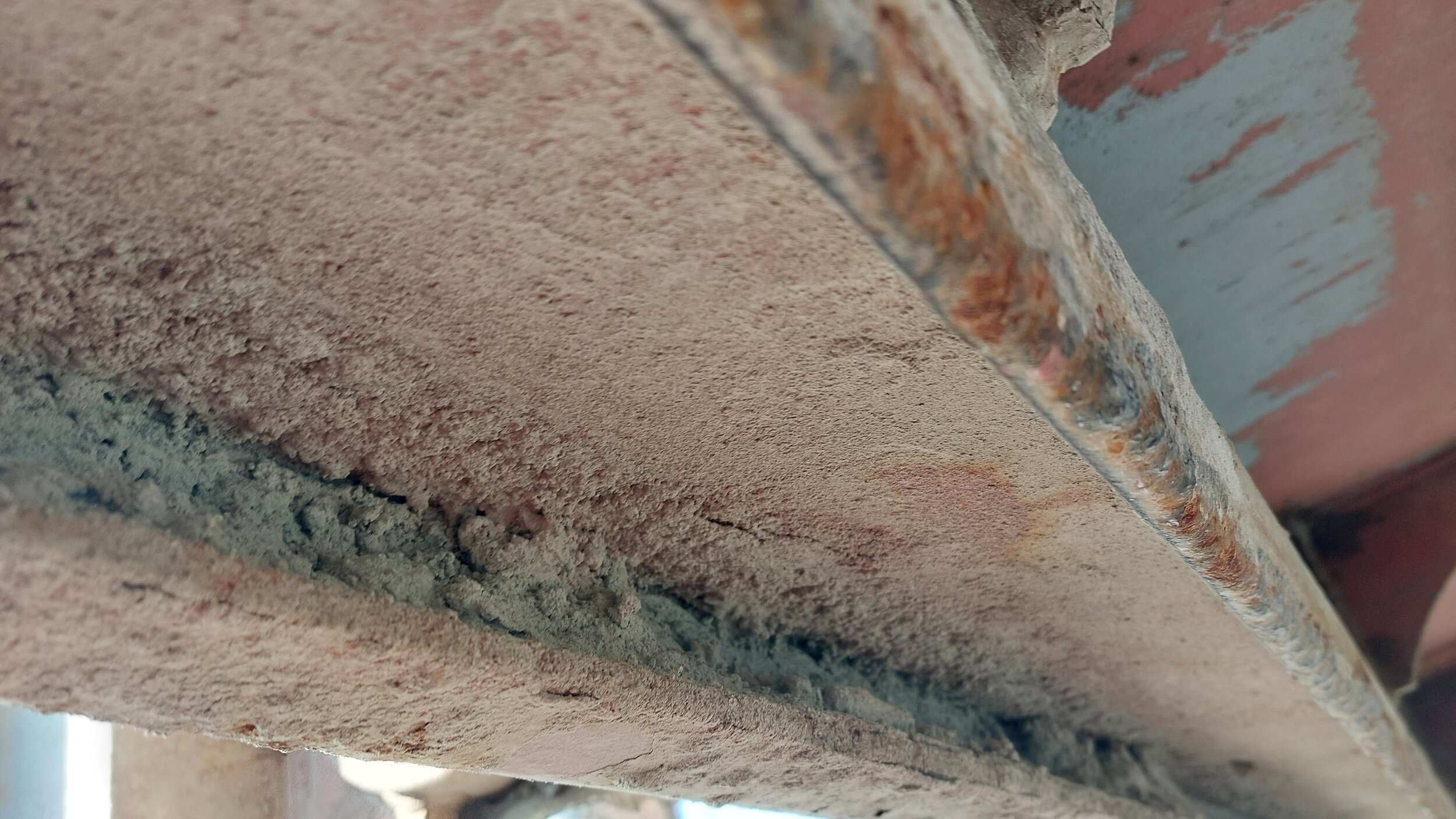 View of hatch cover drain channel, note residues of cement