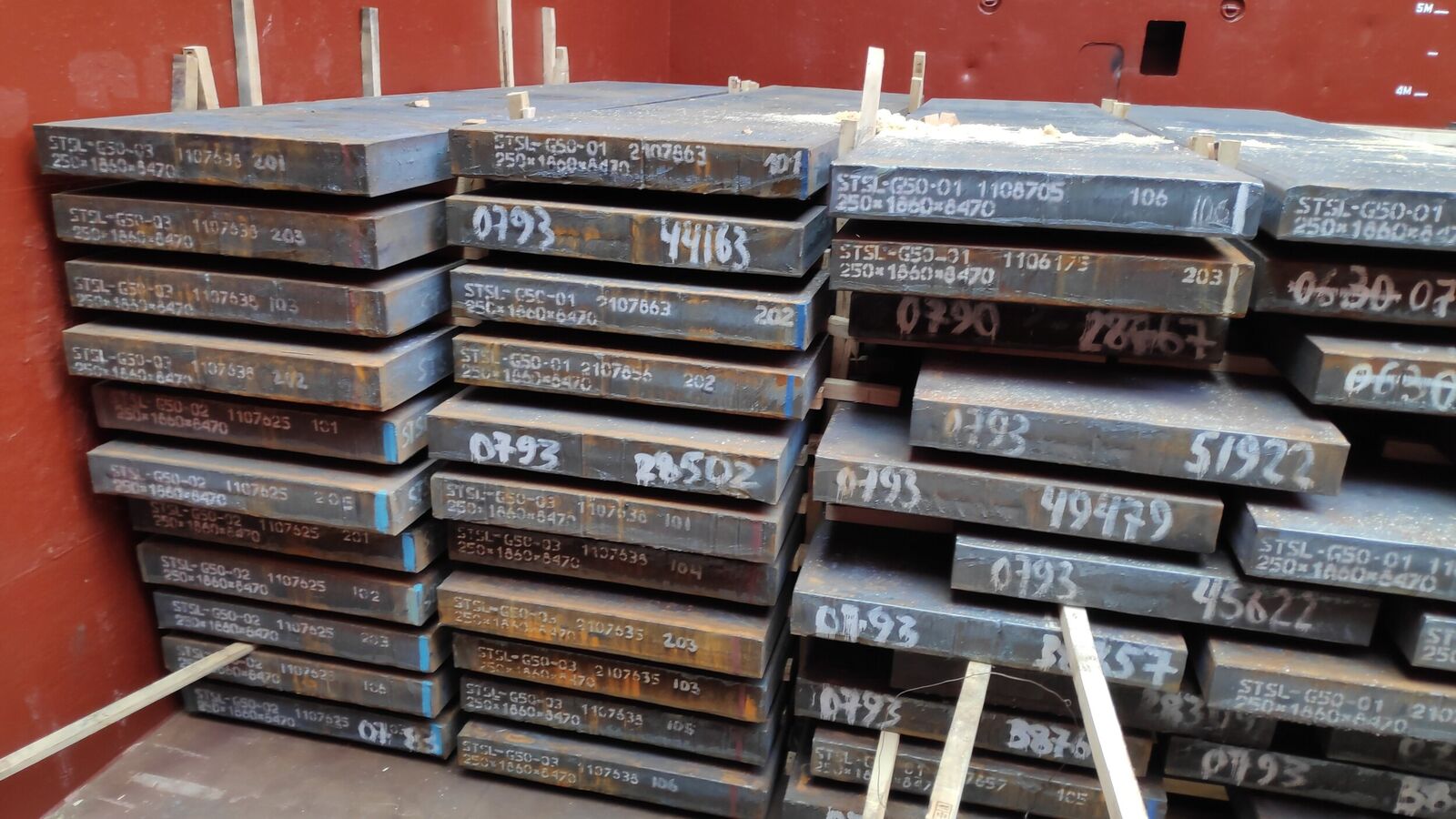 Steel slabs loaded in hold, chocking by timbers of top layer