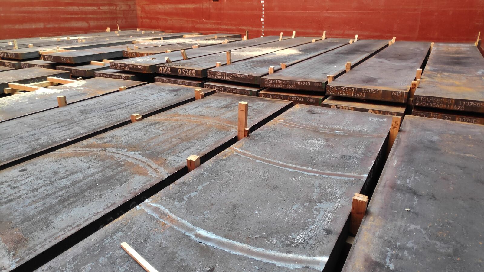 Steel slabs loaded in hold, chocking by timbers of top layer