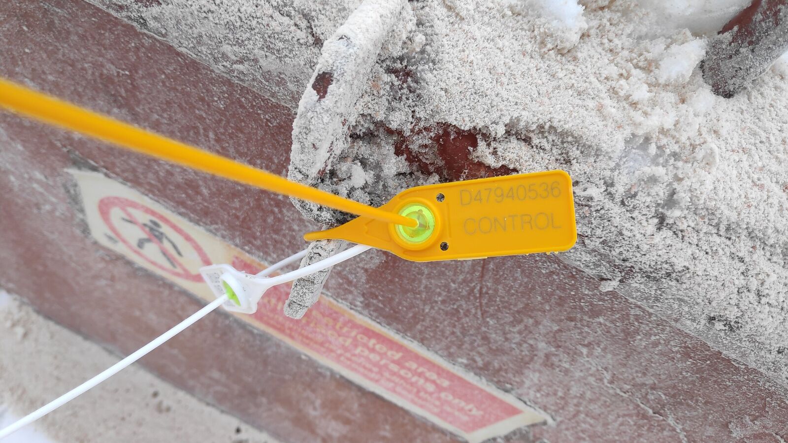 Manhole sealed with plastic numbered seal