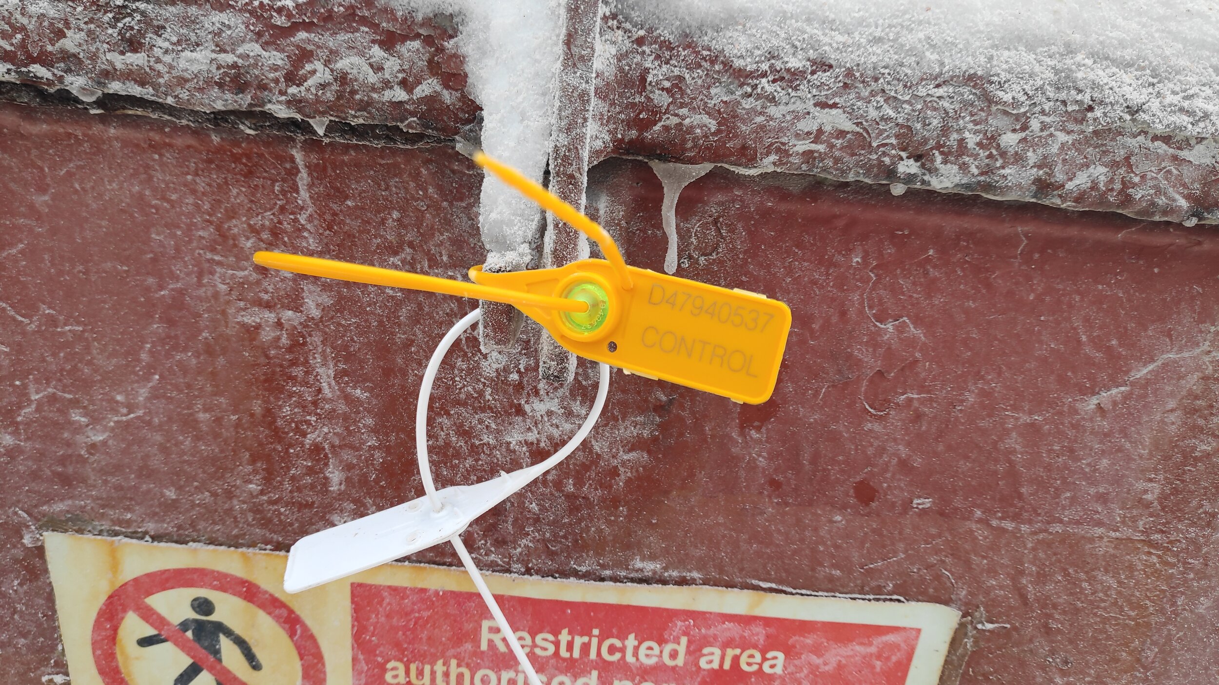 Manhole sealed with plastic numbered seal