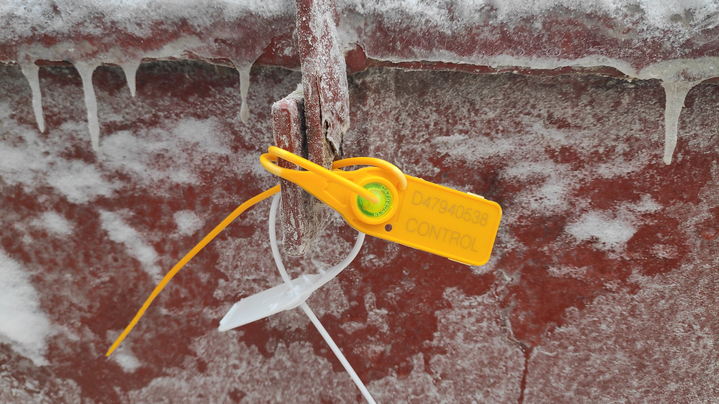 Manhole sealed by plastic numbered seal