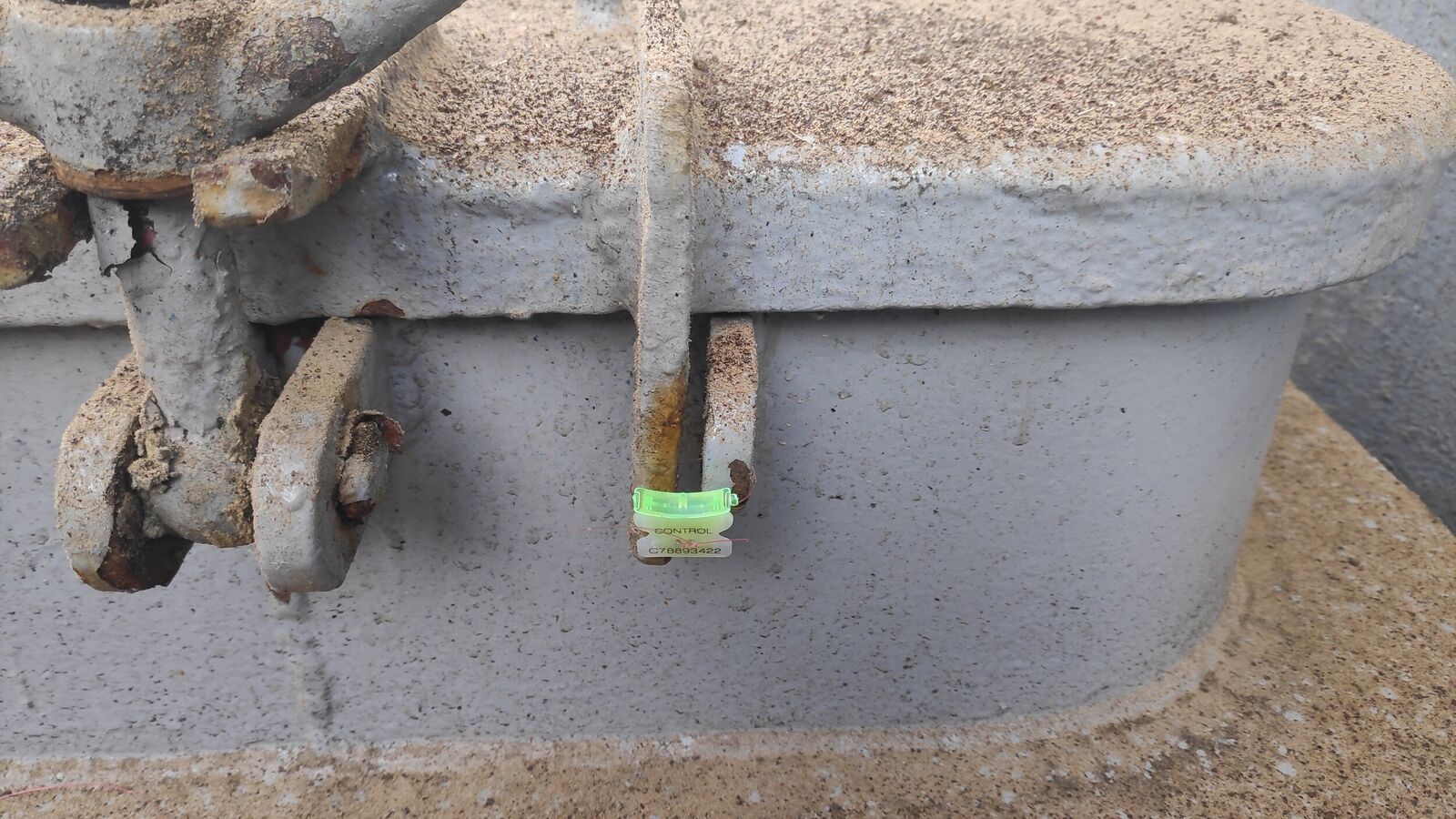 General view of manhole sealed with plastic numbered clip seal