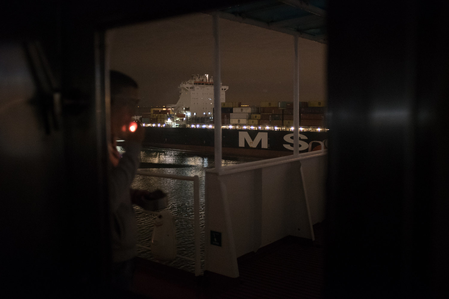 Person smoking a cigarette on the ship