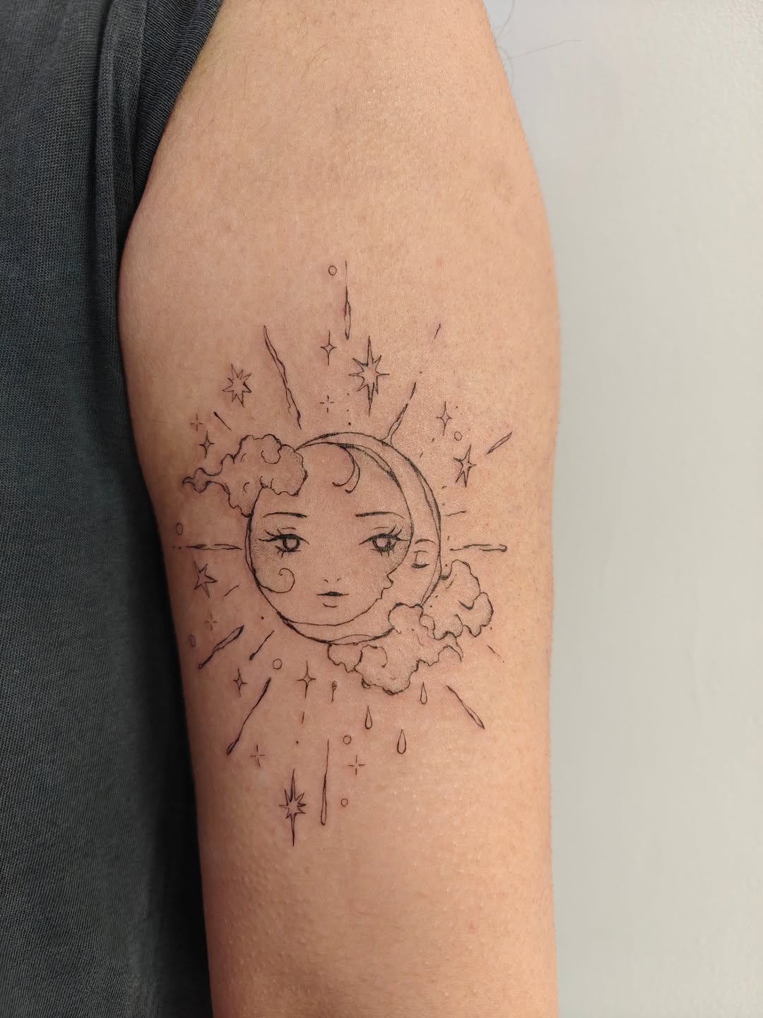 Delicate sun and moon celestial sketch with wispy clouds