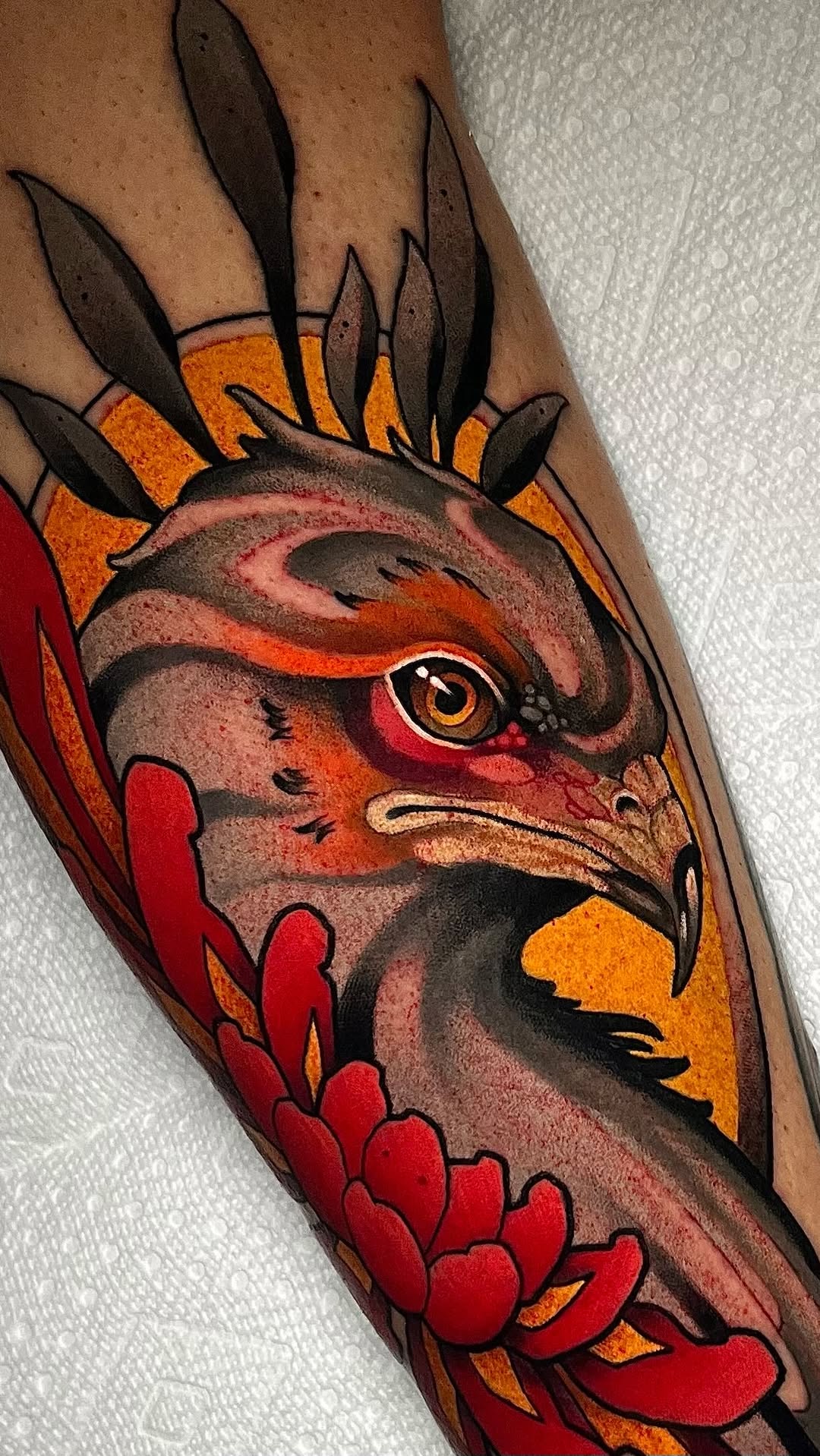 Bold neo-traditional secretary-bird head with chrysanthemum.