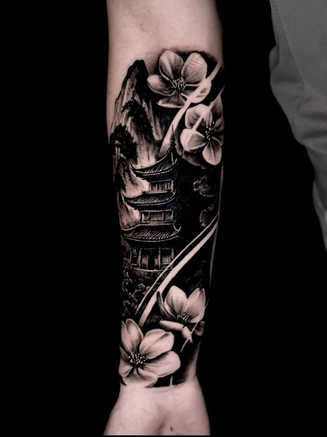 Monochrome Japanese pagoda scene with blooming flowers