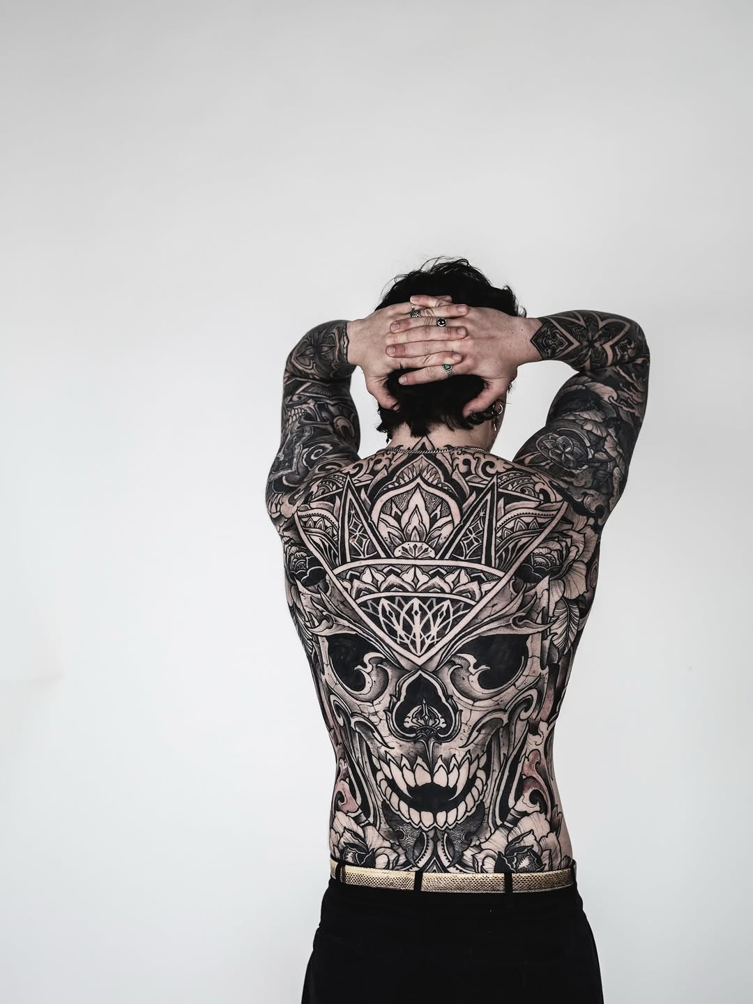 Intricate blackwork back piece with ornate skull motif
