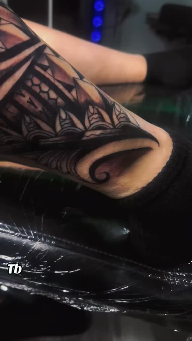 Intricate blackwork geometric floral band around ankle