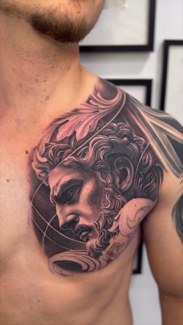 Dramatic black-and-gray realism of a classical bust