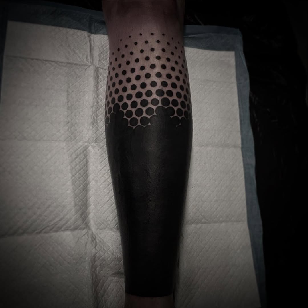 Halftone dotwork gradient fading into solid black calf