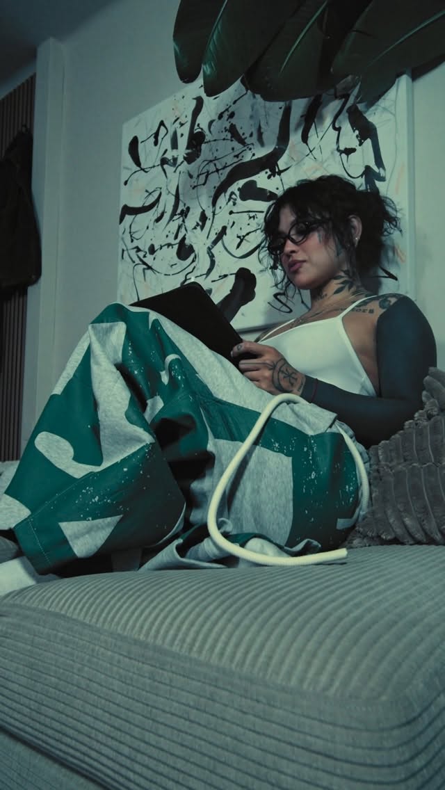 Bold black geometric shoulder tattoo with sharp lines