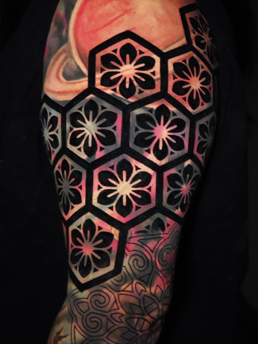 Bold honeycomb hex tiling with floral blackwork