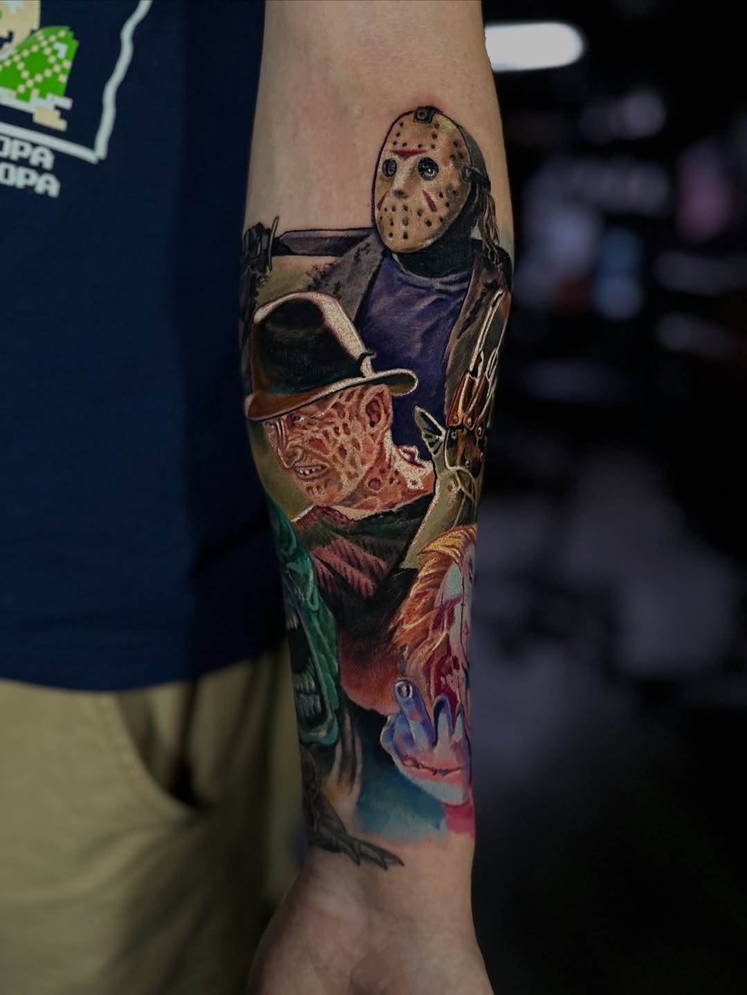 Vivid horror-icon collage sleeve featuring Jason Voorhees, Freddy Krueger, Leatherface.