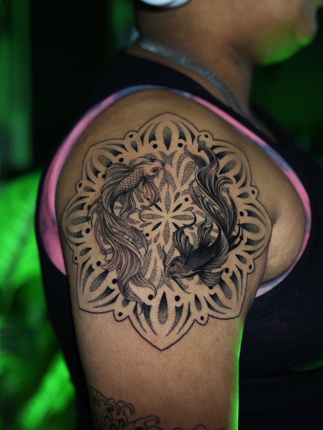 Intricate koi swirl within a delicate mandala frame