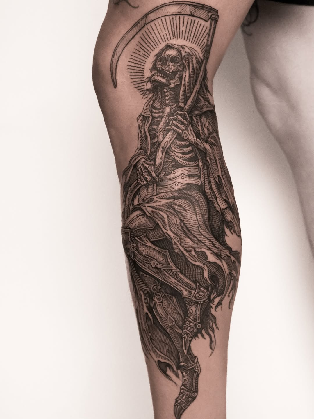 Intricate blackwork grim reaper with scythe and halo