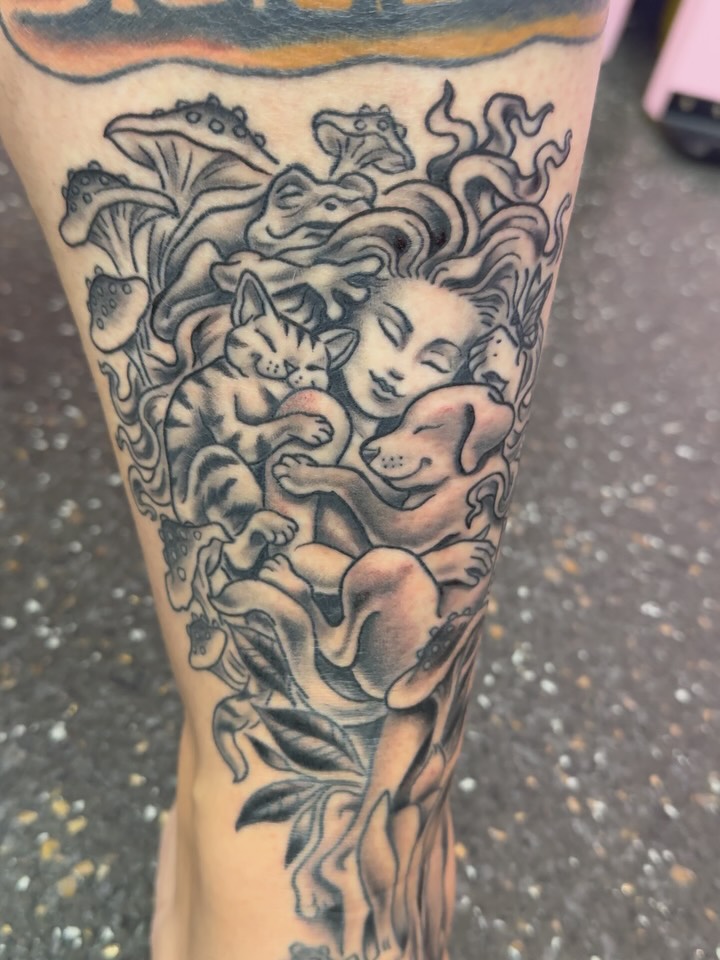 Sleeping animals cuddle a serene figure in neo-traditional