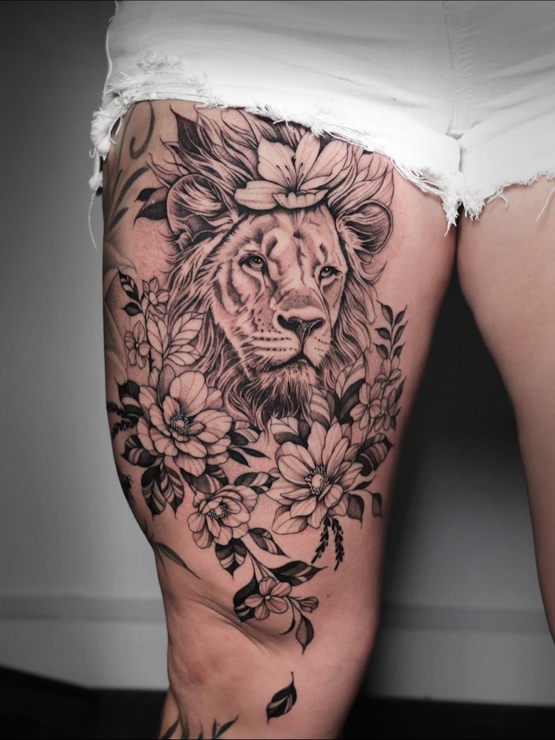 Lush floral frame surrounding a regal lion head