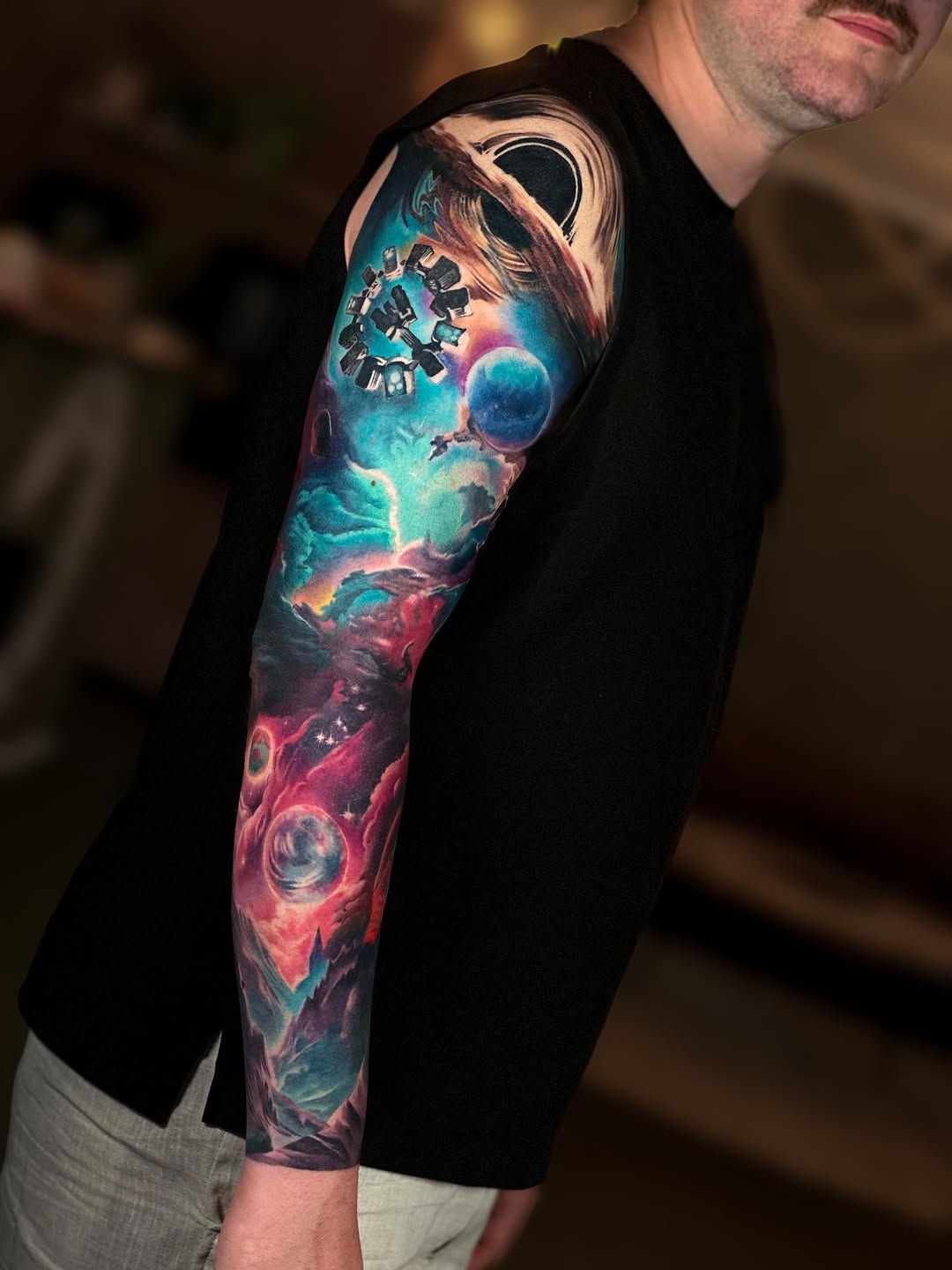 Vibrant interstellar sleeve with nebulae and planets